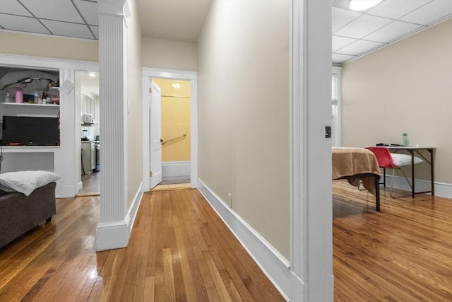 130 Glenville Ave, Boston, MA 02134 - hall featuring ornate columns, wood-type flooring, and a drop ceiling