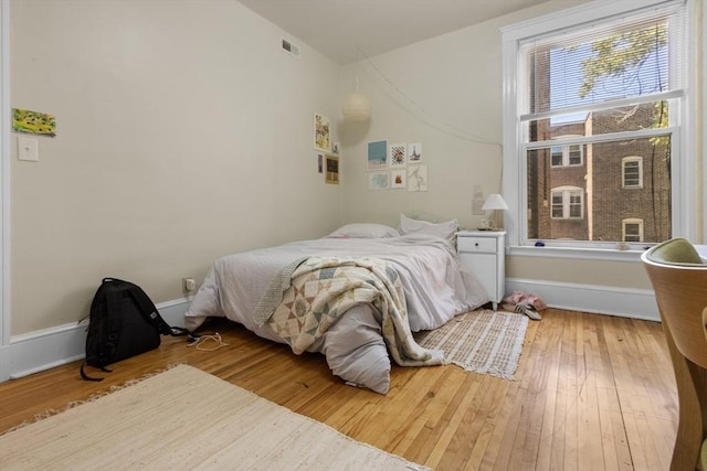 130 Glenville Ave, Boston, MA 02134 - bedroom with wood-type flooring and baseboards