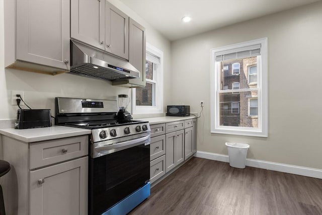 130 Glenville Ave, Boston, MA 02134 - kitchen with gas stove, under cabinet range hood, dark wood-style flooring, light countertops, and recessed lighting