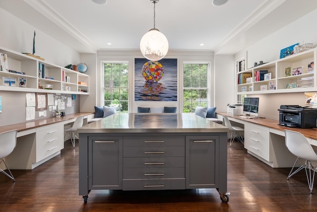 office area with built in desk, a wealth of natural light, and dark wood-type flooring