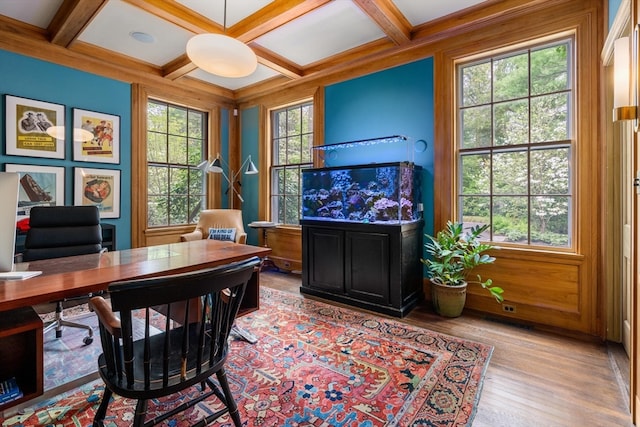 office with wood-type flooring, coffered ceiling, and beam ceiling