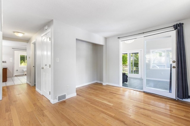 7 Cornish St, Carver, MA 02330 - unfurnished room with light wood-style flooring, baseboards, and a smoke detector