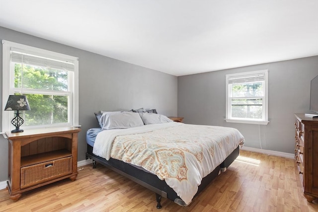 7 Cornish St, Carver, MA 02330 - bedroom with multiple windows, light wood finished floors, and baseboards