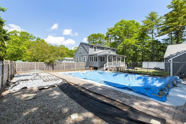 7 Cornish St, Carver, MA 02330 - view of swimming pool featuring a fenced backyard, a sunroom, and a patio area