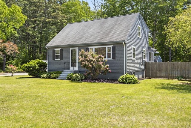 7 Cornish St, Carver, MA 02330 - cape cod house featuring a garage and roof with shingles