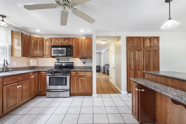 7 Cornish St, Carver, MA 02330 - kitchen featuring appliances with stainless steel finishes, a sink, brown cabinetry, decorative light fixtures, and recessed lighting