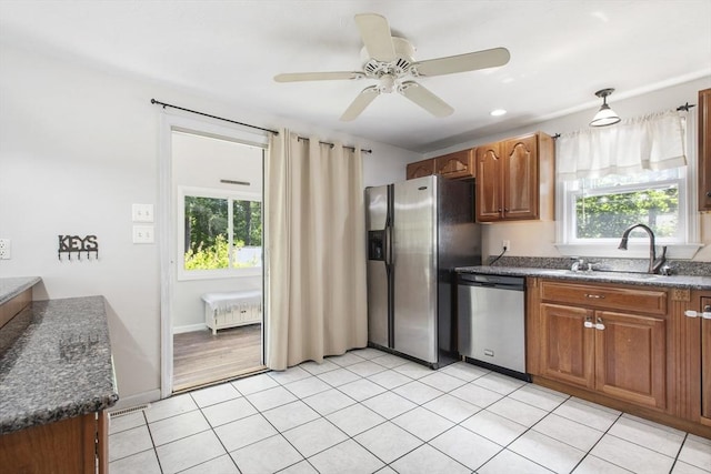 7 Cornish St, Carver, MA 02330 - kitchen featuring stainless steel appliances, healthy amount of natural light, and dark countertops