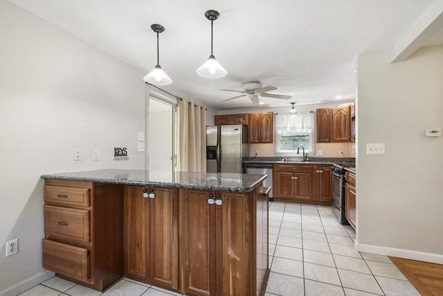 7 Cornish St, Carver, MA 02330 - kitchen featuring stainless steel appliances, a sink, a peninsula, ceiling fan, and baseboards