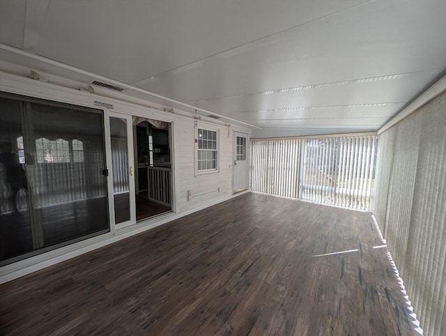 unfurnished sunroom featuring visible vents