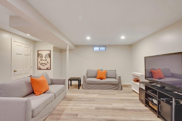 living area featuring baseboards, recessed lighting, and light wood-style floors