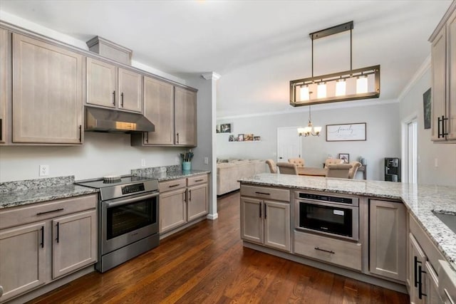 kitchen with appliances with stainless steel finishes, dark wood-type flooring, light stone counters, pendant lighting, and crown molding