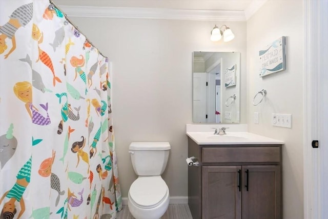 bathroom featuring toilet, vanity, crown molding, and a shower with curtain