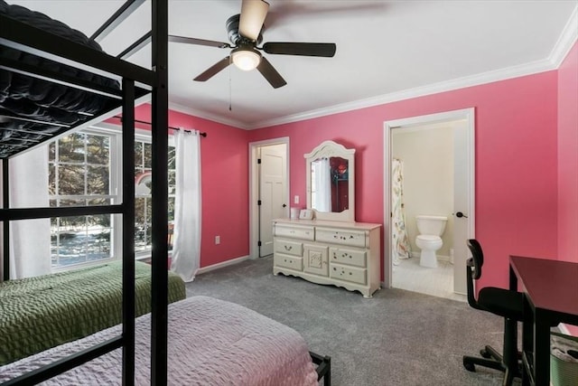 carpeted bedroom with ceiling fan, ornamental molding, and ensuite bathroom