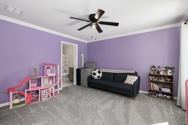 game room featuring ceiling fan, carpet flooring, and ornamental molding