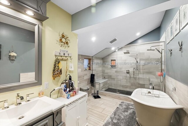 8 New Spencer Rd, Charlton, MA 01507 - full bath with lofted ceiling, a stall shower, vanity, and a freestanding bath