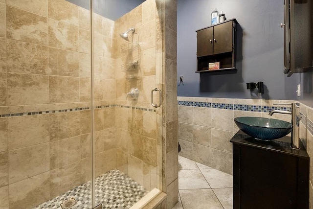 8 New Spencer Rd, Charlton, MA 01507 - full bath with tile walls, a shower stall, vanity, tile patterned floors, and a wainscoted wall