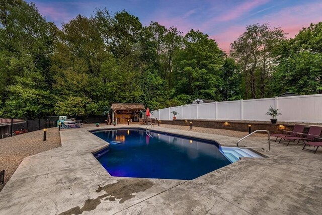 8 New Spencer Rd, Charlton, MA 01507 - view of pool featuring a patio area, a fenced backyard, and view of scattered trees