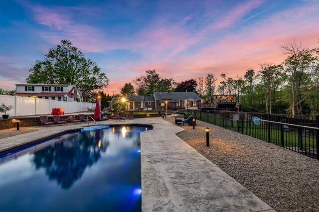 8 New Spencer Rd, Charlton, MA 01507 - pool at dusk featuring fence and a patio