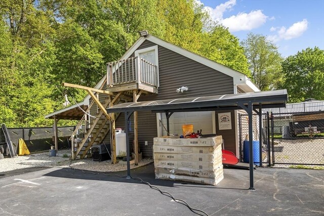 8 New Spencer Rd, Charlton, MA 01507 - view of front of home with fence, a balcony, and stairs