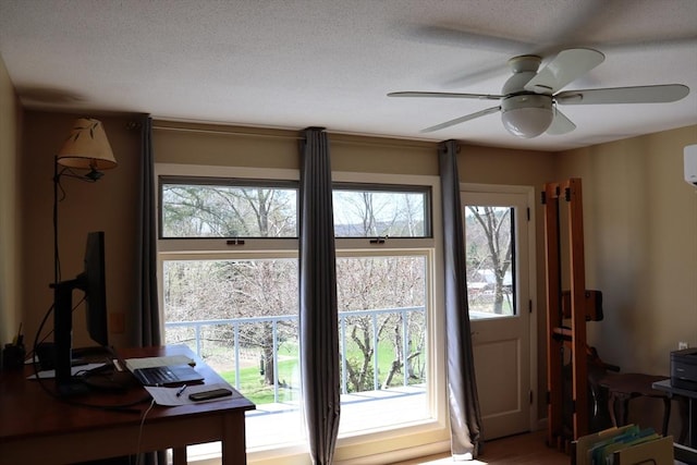 doorway to outside with ceiling fan and wood finished floors