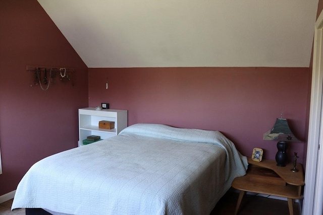 bedroom with lofted ceiling