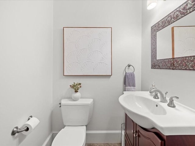 1 Auburn Ct Unit 1, Brookline, MA 02446 - bathroom with vanity, toilet, and baseboards