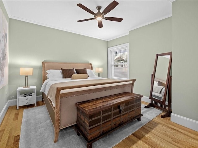 1 Auburn Ct Unit 1, Brookline, MA 02446 - bedroom with ornamental molding, wood finished floors, baseboards, and a ceiling fan