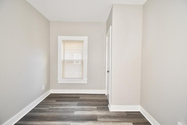 empty room featuring dark wood-type flooring