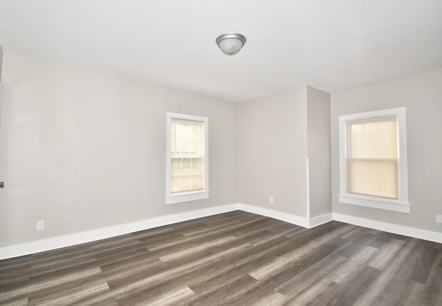 unfurnished room featuring dark hardwood / wood-style floors