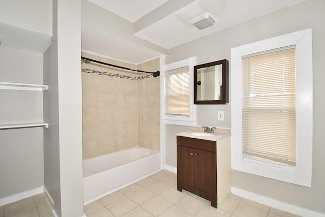 bathroom with tiled shower / bath, vanity, tile patterned floors, and plenty of natural light