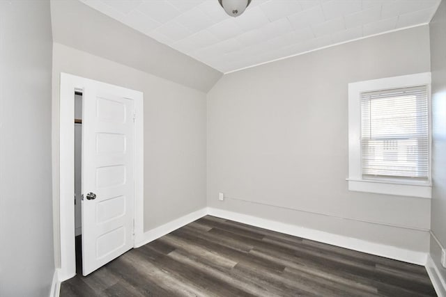 unfurnished room featuring dark wood-type flooring