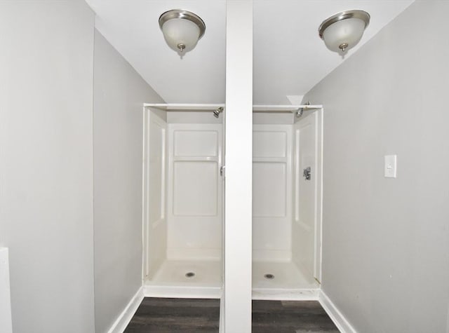 bathroom featuring hardwood / wood-style floors and walk in shower