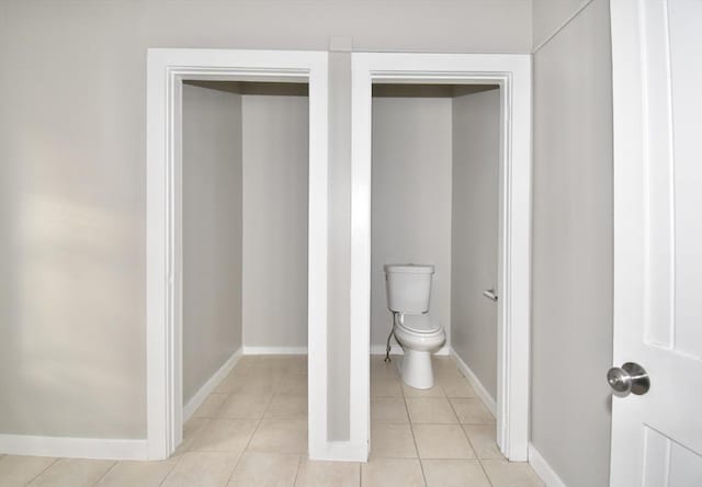 bathroom featuring tile patterned flooring and toilet