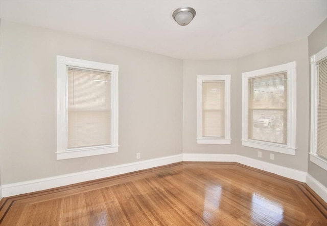 empty room featuring wood-type flooring