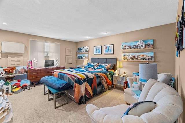 bedroom with a textured ceiling and carpet floors