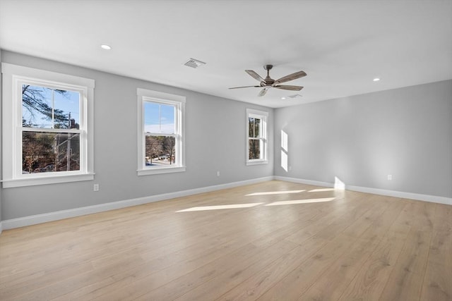 empty room featuring light wood-type flooring and ceiling fan