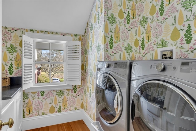 laundry area featuring hardwood / wood-style floors and separate washer and dryer