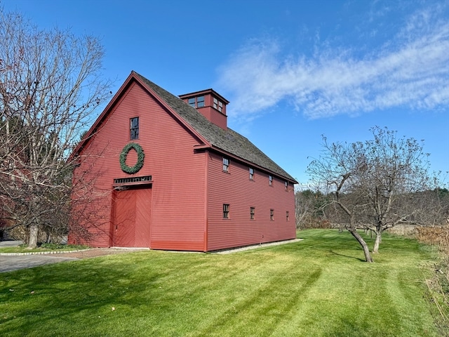 view of home's exterior with a yard