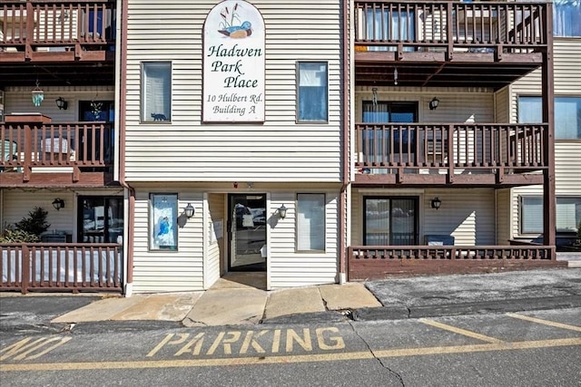 view of property featuring uncovered parking