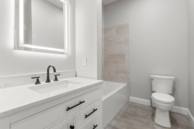 bathroom with vanity, toilet, and tile patterned floors