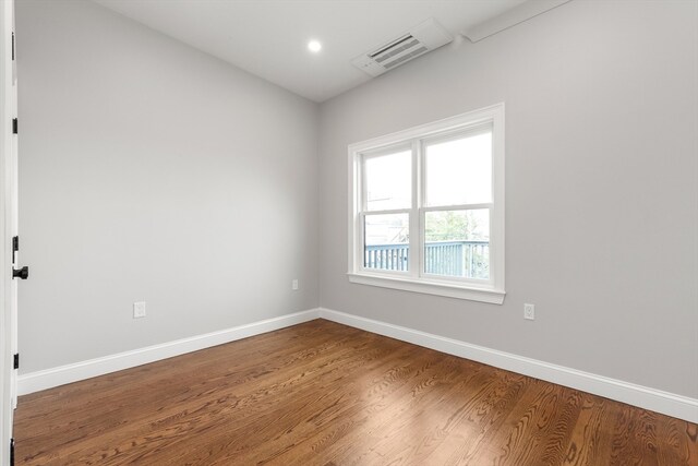 spare room featuring hardwood / wood-style flooring