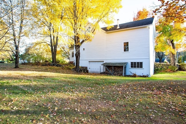 view of home's exterior with a yard