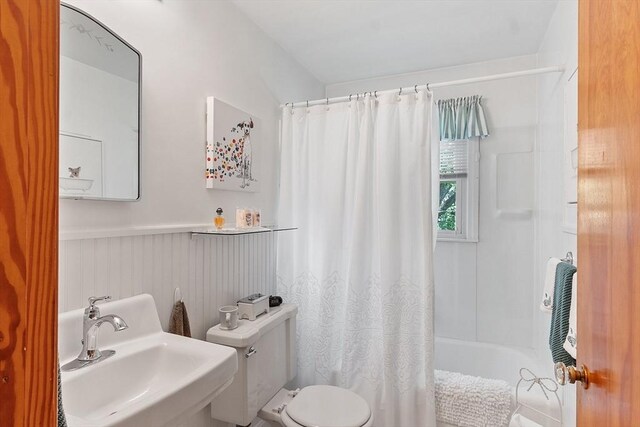 890 Westford St, Lowell, MA 01850 - bathroom featuring shower / bath combination with curtain and wainscoting