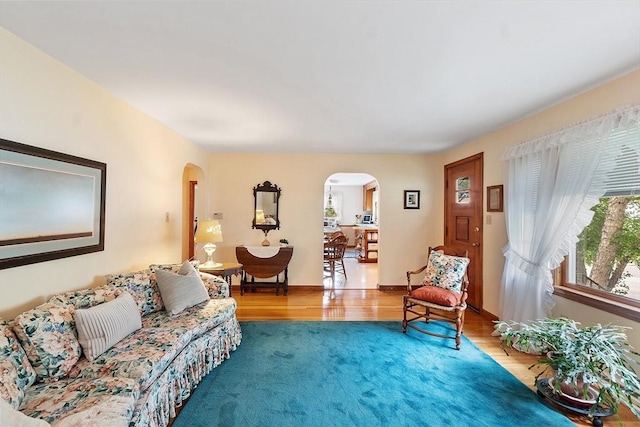 890 Westford St, Lowell, MA 01850 - living room with arched walkways and wood finished floors