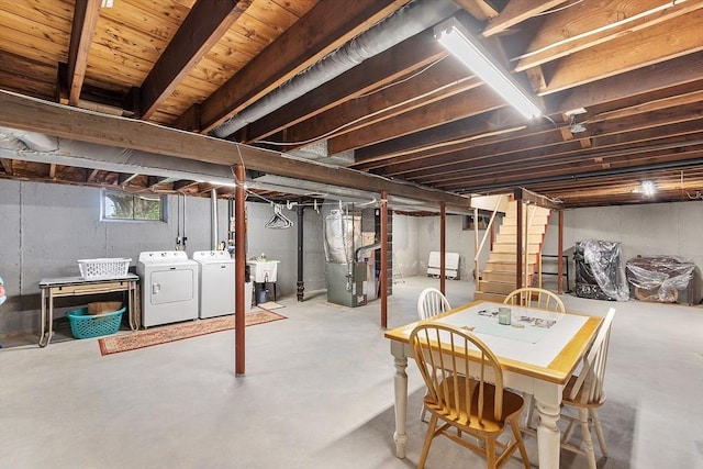 890 Westford St, Lowell, MA 01850 - basement with heating unit, washing machine and dryer, and stairway