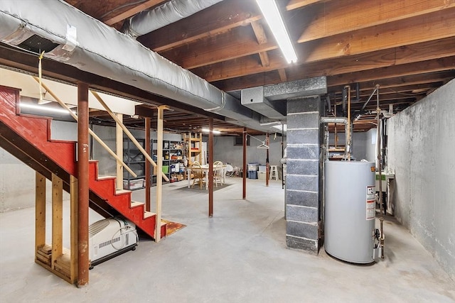 890 Westford St, Lowell, MA 01850 - unfinished below grade area featuring gas water heater and stairway