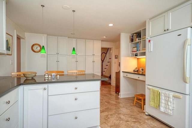 kitchen featuring dark countertops, open shelves, freestanding refrigerator, recessed lighting, and white cabinetry