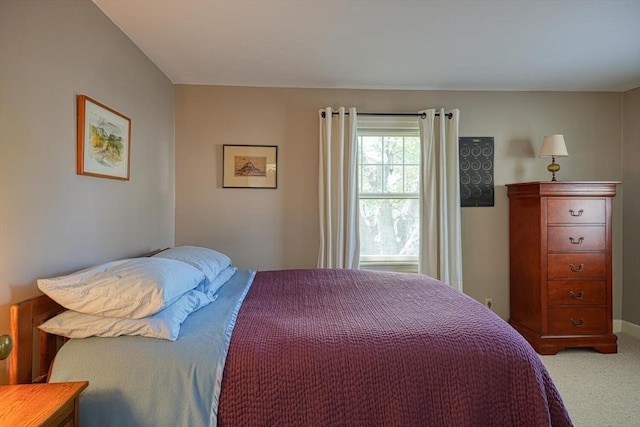 bedroom featuring light carpet