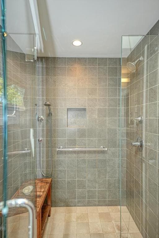 bathroom with recessed lighting and a shower stall