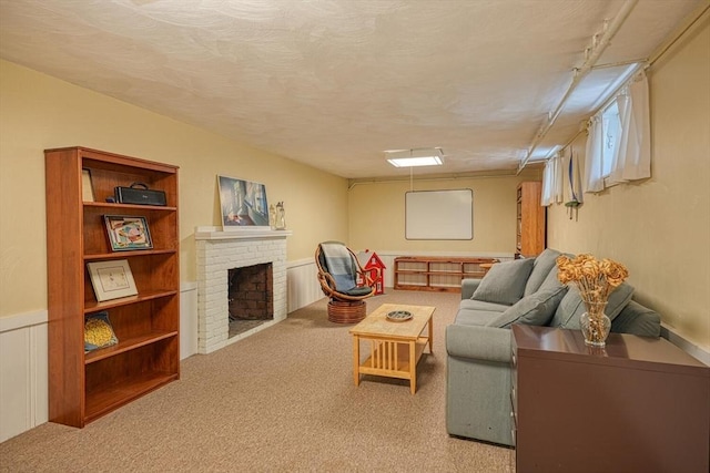 living room with carpet floors and a brick fireplace
